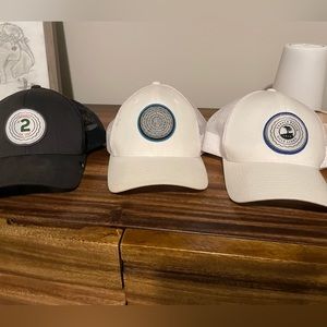 Three Travis Mathew golf hats